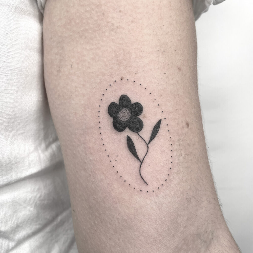 simple black flower tattoo